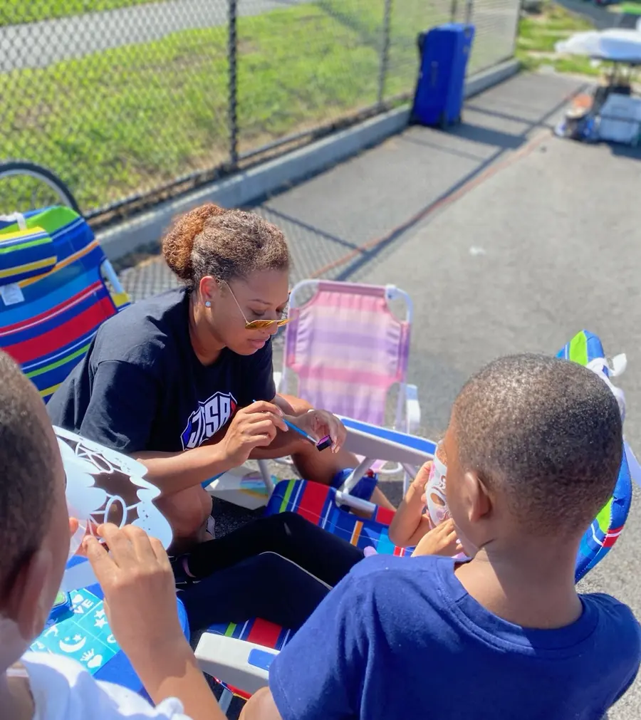 Children participating in a creative activity at a JTSA family event